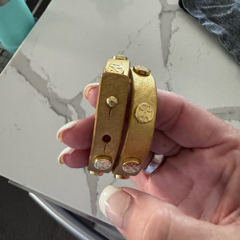 Tory Burch NWOT gold double metallic leather bracelet.